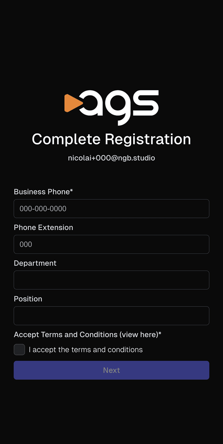 A registration screen with the ags logo (featuring an orange play button triangle next to white letters) on a black background. The page displays "Complete Registration" as a heading, with an email address "nicolai+000@ngb.studio" shown below it. The form contains fields for Business Phone (required, filled with "000-000-0000"), Phone Extension (filled with "000"), Department (empty), and Position (empty). At the bottom is an unchecked checkbox for "Accept Terms and Conditions (view here)*" with text "I accept the terms and conditions" next to it. A purple button labeled "Next" appears at the bottom of the screen.