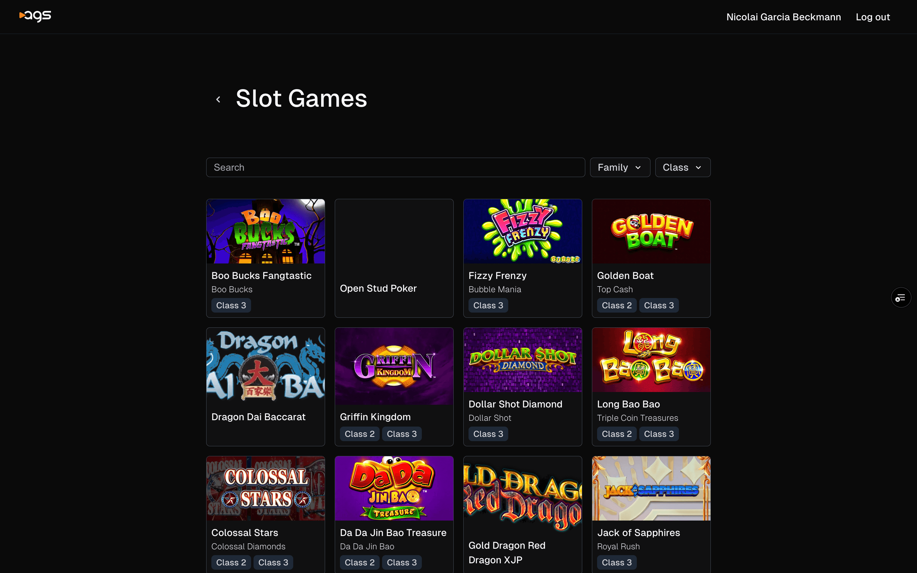 A webpage displaying a collection of slot games with a black background. At the top is the "AGS" logo and a navigation bar showing the logged in user's name and "Log out" options. The main section is titled "Slot Games" with a search bar and filter options for "Family" and "Class". Below are grid-displayed slot game thumbnails including: Boo Bucks Fangtastic, Open Stud Poker, Fizzy Frenzy, Golden Boat, Dragon Dai Baccarat, Griffin Kingdom, Dollar Shot Diamond, Long Bao Bao, Colossal Stars, Da Da Jin Bao Treasure, Gold Dragon Red, and Jack of Sapphires. Each game card shows the title, subtitle, and class designation (Class 2 or Class 3).